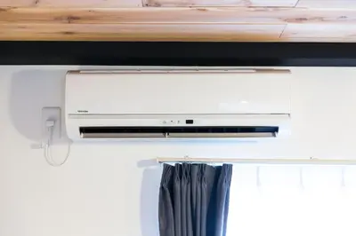 a room with a window with a air conditioner at Azur Shibuya -Apartment House- in Tokyo