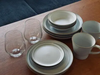 a table with plates and wine glasses on it at \u30c8\u30e9\u30a4\u30a2\u30f3\u30b0\u30eb\u82e5\u5bae201 trianglewakamiya in Tokyo