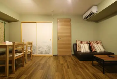 a living room with a couch and a table at Best Value 2BR that Sleep 6, Quiet neighborhood, Close to Metro in Tokyo