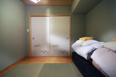 a room with a closet with white pillows and a door at Best Value 2BR that Sleep 6, Quiet neighborhood, Close to Metro in Tokyo