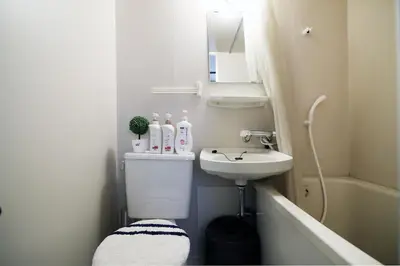 a small bathroom with a sink and a toilet at Best Value 2BR that Sleep 6, Quiet neighborhood, Close to Metro in Tokyo