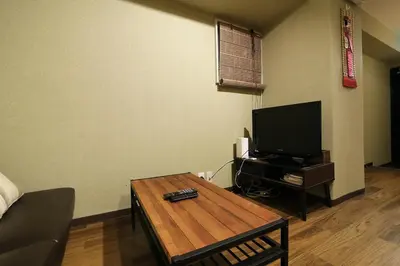a living room with a television and a coffee table at Best Value 2BR that Sleep 6, Quiet neighborhood, Close to Metro in Tokyo