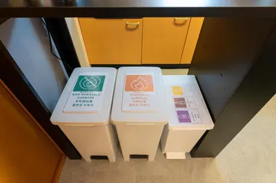 two trash cans sitting in a drawer in a room at Sakura Fan 2F in Tokyo