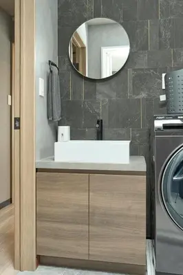 a bathroom with a sink and a mirror at Comfort Stay \u4e2d\u91ce in Tokyo