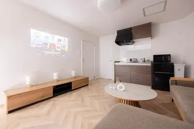 a living room with a couch and a table at Laputa \u6c60\u888b in Tokyo