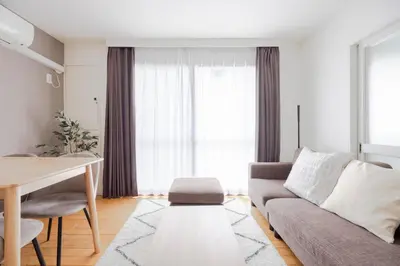 a living room with a couch and a table at Laputa \u6c60\u888b in Tokyo