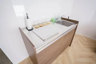 a kitchen with a sink and a counter top at Laputa \u6c60\u888b in Tokyo