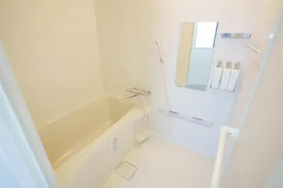 a white bathroom with a tub and a sink at Laputa \u6c60\u888b in Tokyo