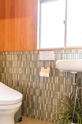 a bathroom with a toilet and a sink at Two-Story Japandi Villa in Tokyo in Tokyo