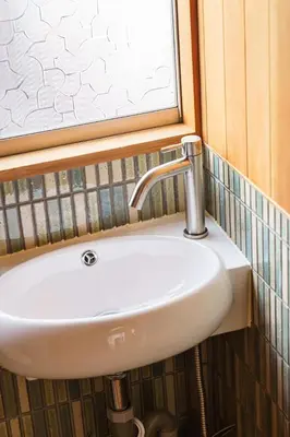 a white sink in a bathroom with a window at Two-Story Japandi Villa in Tokyo in Tokyo
