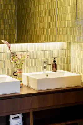 a bathroom with a sink and a vase of flowers at Two-Story Japandi Villa in Tokyo in Tokyo