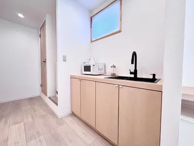 a kitchen with a sink and a microwave at POINT Apartment Hotel - Ueno - Asakusa - Iriya in Tokyo