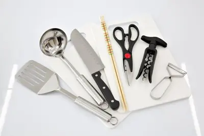 a group of scissors and other kitchen utensils on a white surface at Oliver 401 in Tokyo