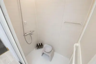 a bathroom with a shower and a toilet at Oliver 401 in Tokyo