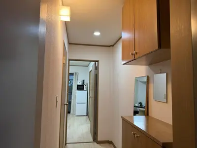 a kitchen with a counter top and a refrigerator at Ikebukuro Area 1F01 AbanNishiikeApartment in Tokyo