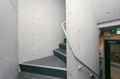a set of stairs in a building with a stair case at aYADO Kinshicho Apartment in Tokyo