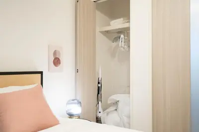 a bedroom with a bed and a closet at \u661f\u7a7a\u3068Riviere in Tokyo