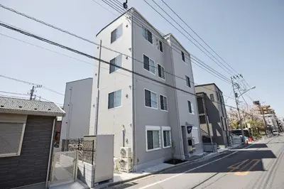 a white building on the side of a street at \u661f\u7a7a\u3068Riviere in Tokyo