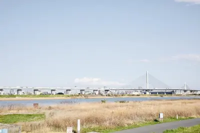 a bridge over a river with a bridge in the background at \u661f\u7a7a\u3068Riviere in Tokyo