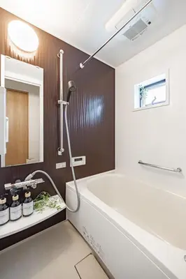 a bathroom with a white tub and a sink at Skytree View! Modern Entire House in Tokyo in Tokyo