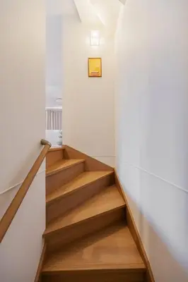 a staircase in a house with wooden floors at Skytree View! Modern Entire House in Tokyo in Tokyo
