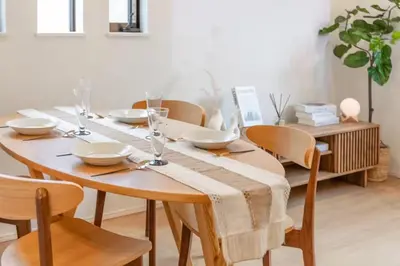 a wooden table with chairs and a table cloth on it at Skytree View! Modern Entire House in Tokyo in Tokyo