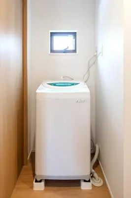 a small white refrigerator in a room with a window at Skytree View! Modern Entire House in Tokyo in Tokyo