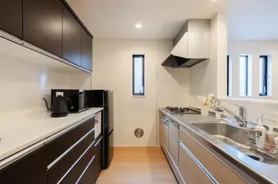 a kitchen with a sink and a refrigerator at Skytree View! Modern Entire House in Tokyo in Tokyo