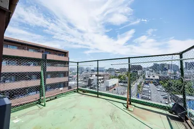 a balcony of a building with a view of a city at Cruise Inn Kameari in Tokyo
