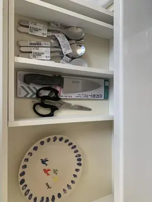 a drawer with a plate and utensils in it at Direct access to Shinjuku 1 station, atrium living room, super large entrance in Tokyo