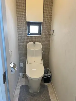 a bathroom with a toilet in a small room at Direct access to Shinjuku 1 station, atrium living room, super large entrance in Tokyo