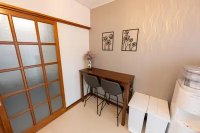 a small room with a desk and two chairs at Vacation Rental -Nagumo301- in Tokyo