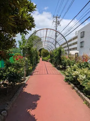 a red walkway with a arch in a garden at Vacation Rental -Nagumo301- in Tokyo