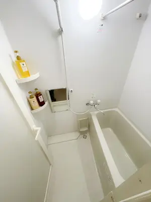 a white bathroom with a tub and a sink at 5mins from JR Kinshicho! Near Asakusa&Skytree! 1101 in Tokyo