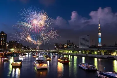 a river with boats in the water with fireworks at 5mins from JR Kinshicho! Near Asakusa&Skytree! 1101 in Tokyo
