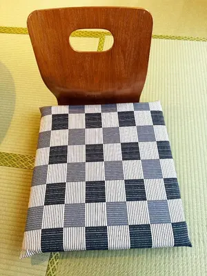 a vase sitting on top of a checkered napkin at Authentic Tatami Quiet Night Ebisu in Tokyo