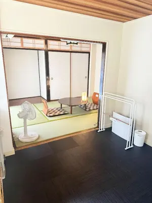 a living room with a table and a window at Authentic Tatami Quiet Night Ebisu in Tokyo