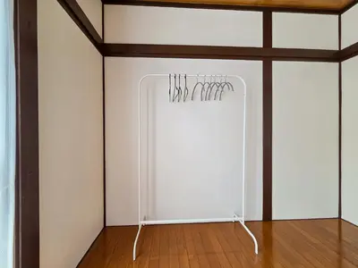 a white refrigerator with hangers in a room at Sakura Wave Stay-Direct Shinjuku 15min & Shibuya 25min in Tokyo
