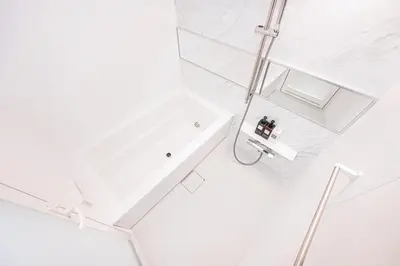 a white bathroom with a shower and a sink at ZAITO-Terra hotel \u65b0\u5fa1\u5f92\u753a\u99c5\u5f92\u6b69\u4e09\u5206 in Tokyo
