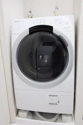 a white microwave oven sitting on a shelf at UMI Tokyo Skytree in Tokyo