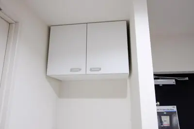 a white cabinet in the corner of a room at UMI Tokyo Skytree in Tokyo