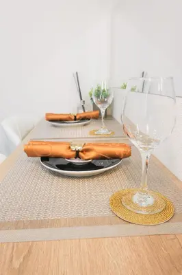 a table with a napkin and a wine glass at UMI Tokyo Skytree in Tokyo