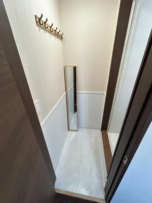 a staircase in a house with a mirror at Sun flower Guest house in Tokyo