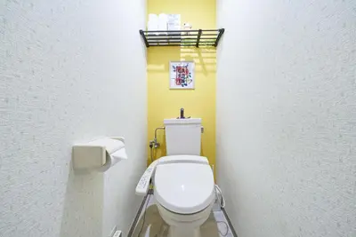 a bathroom with a white toilet in a room at Shamrock Aoto 101 Cozy Tokyo Stay Near Station Airport Disney Access in Tokyo
