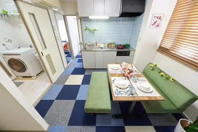 a small kitchen with a table and a sink at Shamrock Aoto 101 Cozy Tokyo Stay Near Station Airport Disney Access in Tokyo