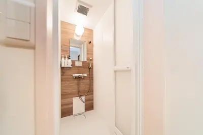 a bathroom with a shower with a mirror at 3BR,2BA,2WC with kitchen and living,7min to skytree subway,Max12P in Tokyo