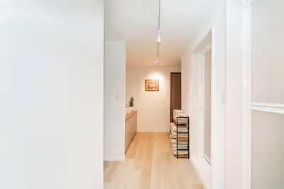 a hallway with white walls and wood floors at 3BR,2BA,2WC with kitchen and living,7min to skytree subway,Max12P in Tokyo