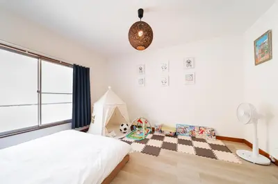 a bedroom with a bed and a large window at 3BR,2BA,2WC with kitchen and living,7min to skytree subway,Max12P in Tokyo