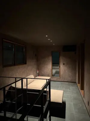 a room with a table and chairs in a room at EKVOLI ROPPONGI TOKYO, Private Hotel in Tokyo