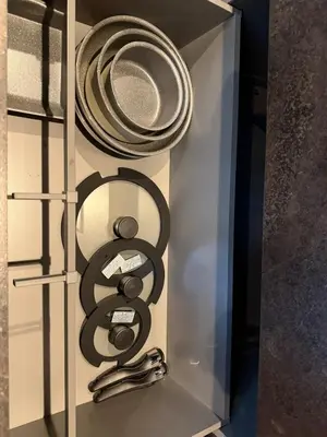 a drawer with plates and utensils in it at EKVOLI ROPPONGI TOKYO, Private Hotel in Tokyo